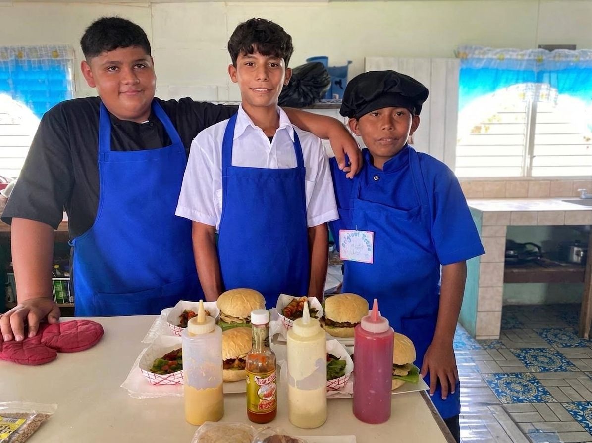 Valley of Peace students cooking in the school kitchen